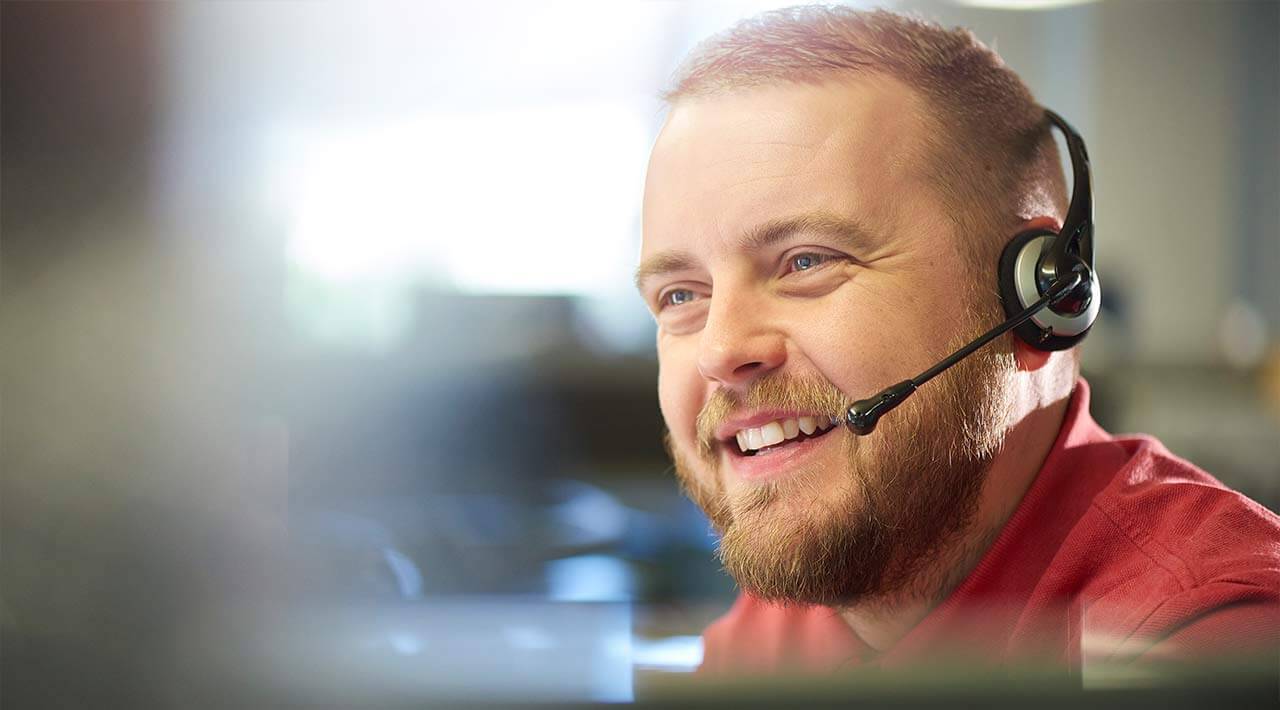 A man talking through a headset